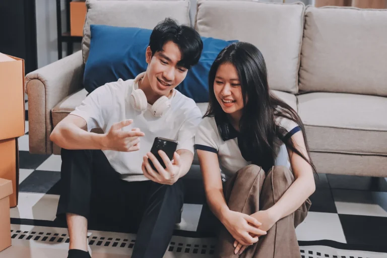 a couple listening to audio on a phone